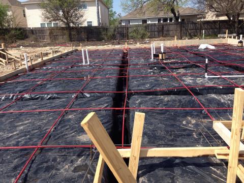 Slab on ground foundation with post tension cables